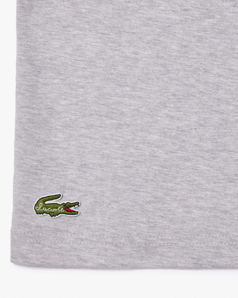 CAMISETA LACOSTE COM SLOGAN EFEITO PIQUÉ - UNISEX